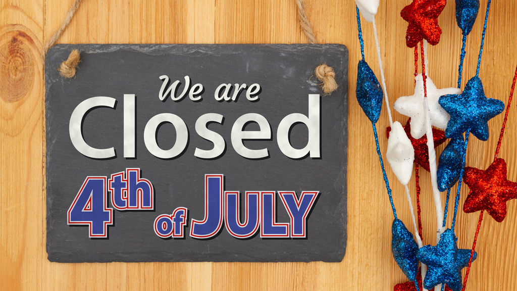 Festive Fourth of July board listing that we are closed