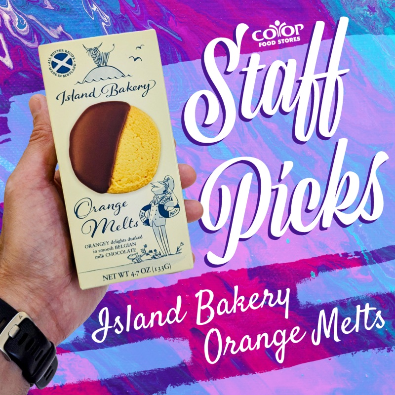Photo of hand holding package of cookies on colorful background