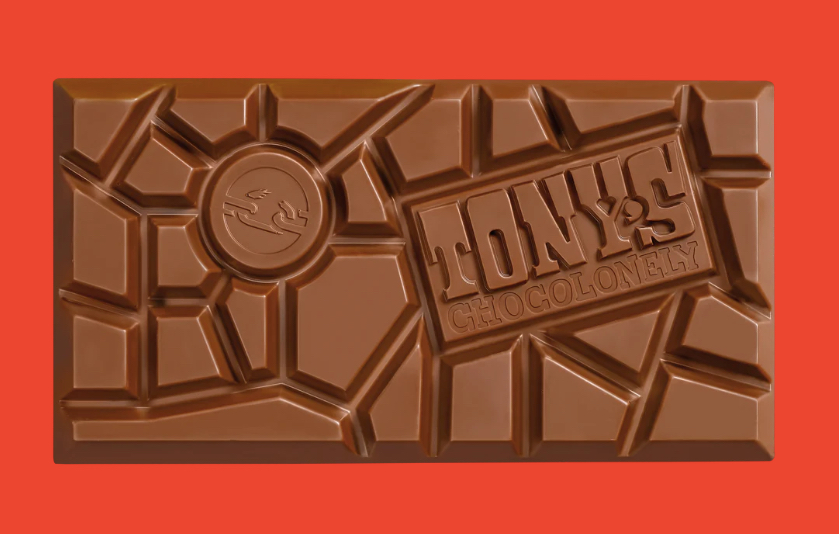 Close up of a Tony's Chocolonely bar on a red background