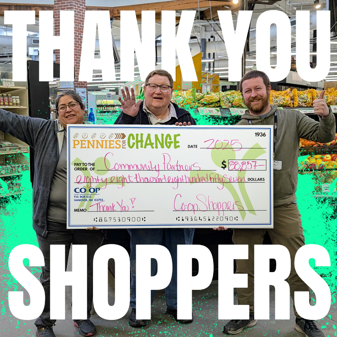 pennies_tota_2025 Co-op employees holding large check for Pennies for Change donations in 2025