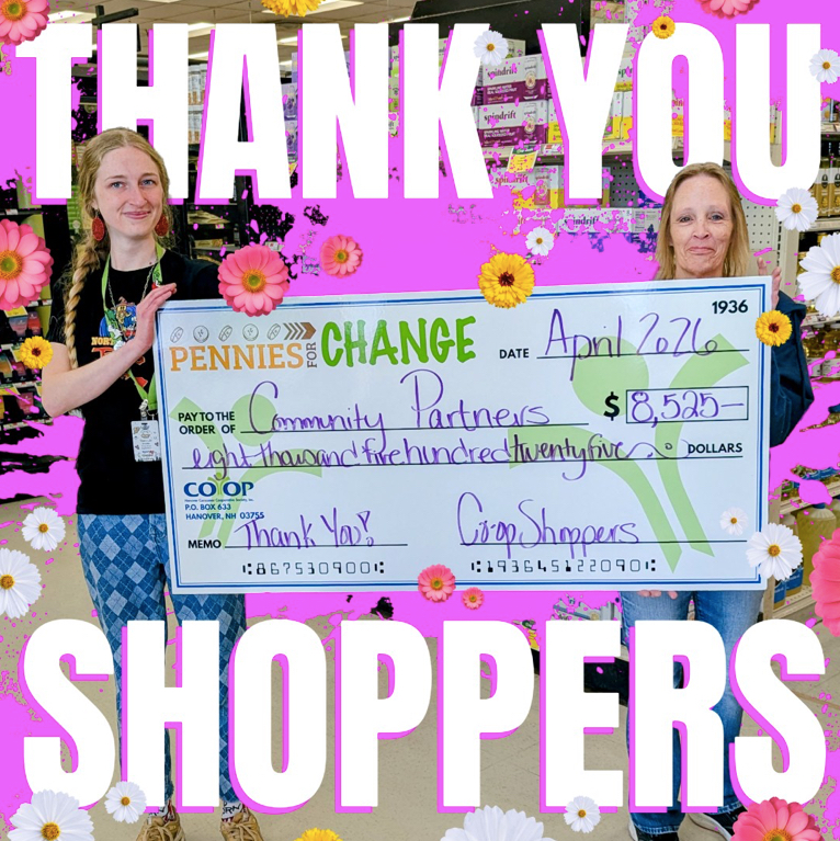 Co-op employees holding large check for April Pennies for Change donations